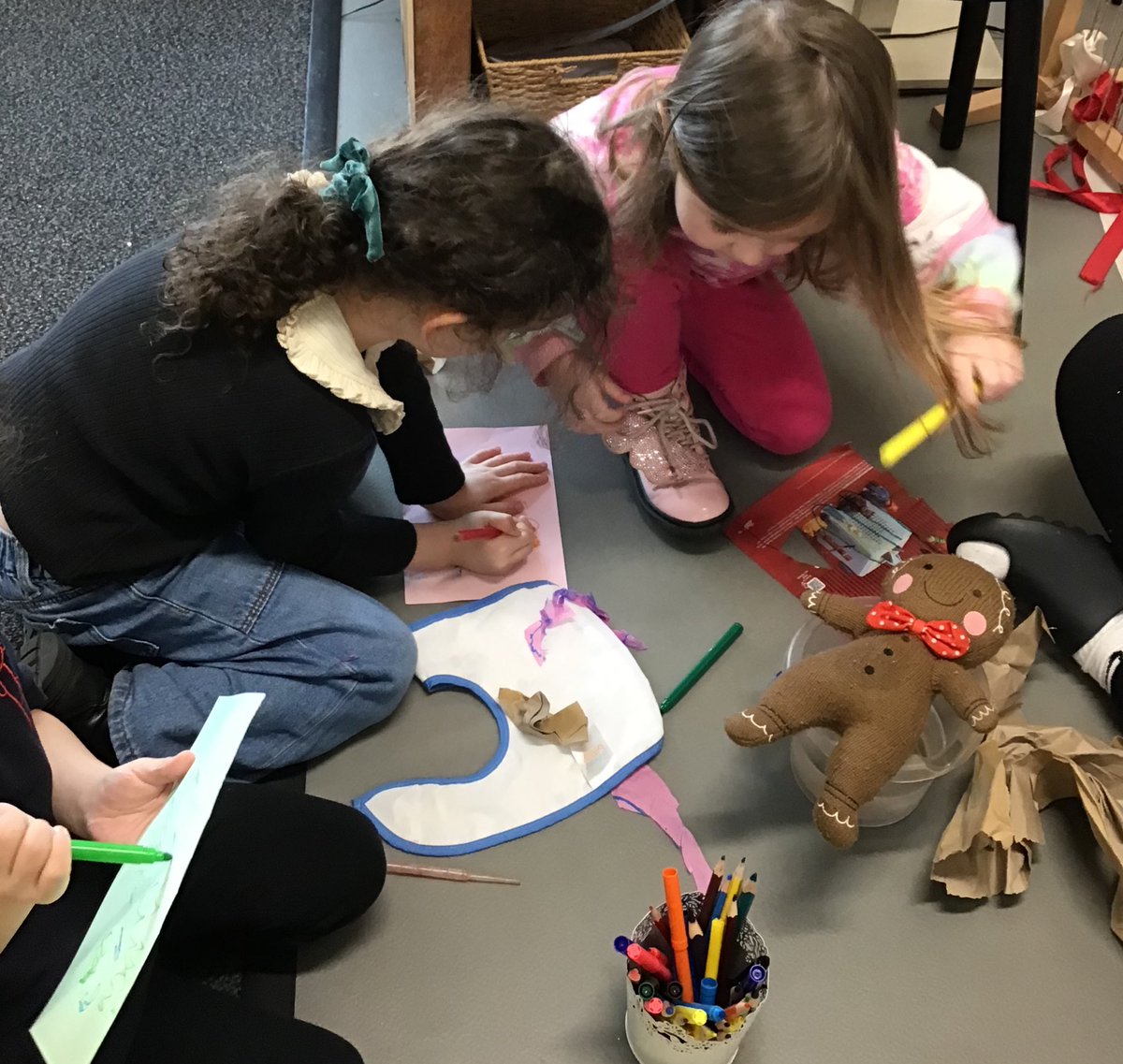 A challenge was set to design and make a coat for the Gingerbread Man to keep him dry. We talked about which materials are waterproof. “The water apron keeps us dry.” (M) The children then tested the coats they made.