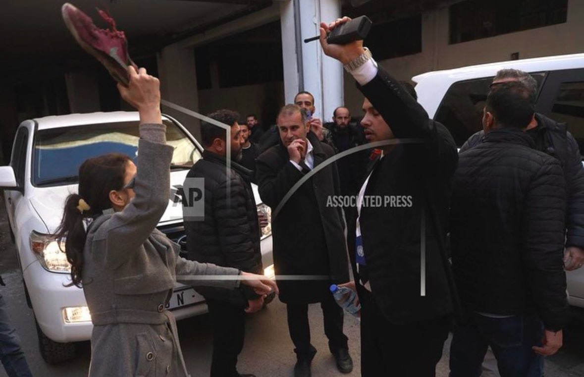 Hussam Hammoud | حسام (@hussamhamoud) on Twitter photo A Syrian woman searching for her relatives detained in #Sednaya prison, who she later discovered were missing, confronts UN Special Envoy <a href="/GeirOPedersen/">Geir O. Pedersen</a> and his delegation by raising her shoe, condemning their failure to protect Syrians from #Assad crimes.
<a href="/omar_albam/">Omar Albam</a> <a href="/AP/">The Associated Press</a> A Syrian woman searching for her relatives detained in #Sednaya prison, who she later discovered were missing, confronts UN Special Envoy <a href="/GeirOPedersen/">Geir O. Pedersen</a> and his delegation by raising her shoe, condemning their failure to protect Syrians from #Assad crimes.
<a href="/omar_albam/">Omar Albam</a> <a href="/AP/">The Associated Press</a>