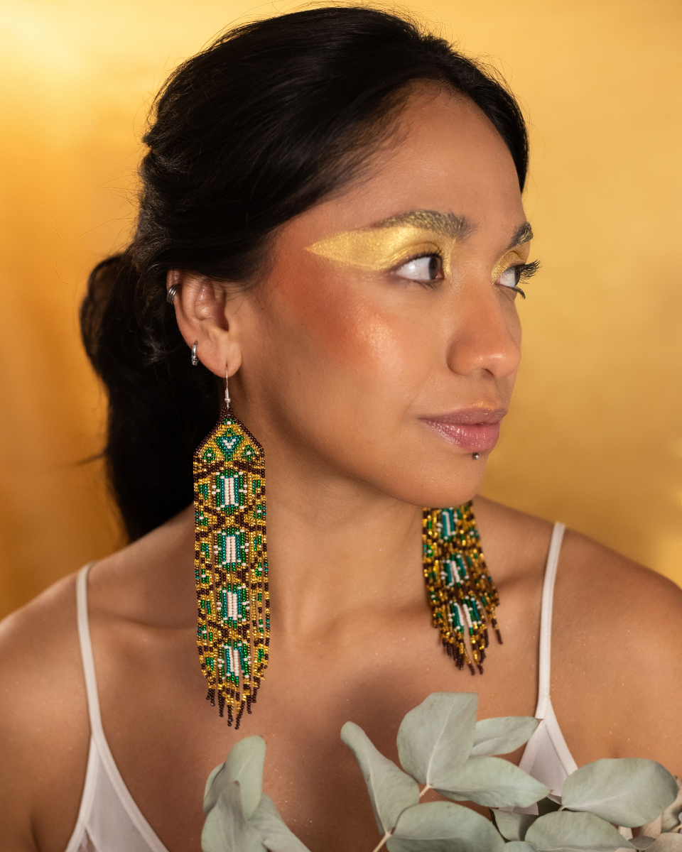 MotherSierra's tweet photo. Step into medieval elegance with our Golden Tapestry Earrings. Woven with gold, green, brown, and white beads, they capture the splendor of ancient castle halls and timeless romance 🏰 ✨🌿

Shop here: https://t.co/2BkmtKnpzs
 #MotherSierra #BeadedJewelry #Handmade https://t.co/kOmwfVRZuy