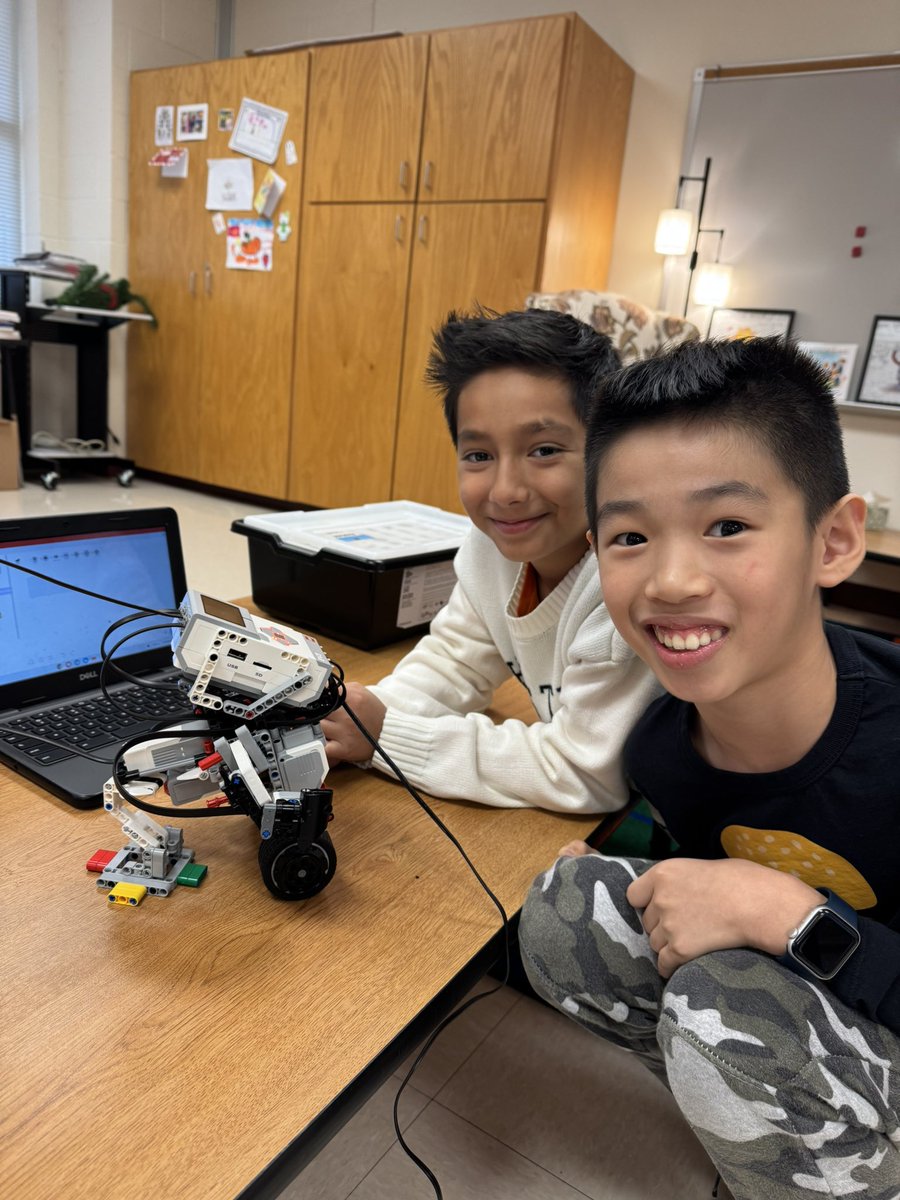 The faces of successful Robotics Engineers! Their build and programming are right on track for their, “Build for Good,” project!