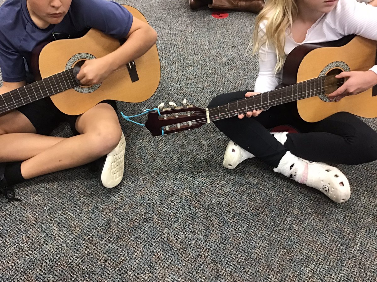 5ths are completing our open strings playing unit this month!  We have learned the parts of a guitar, guitar hold, thumb strumming, and playing with picks.  They are doing an #owlsome job! <a href="/OakviewElem/">Oakview Elementary</a>