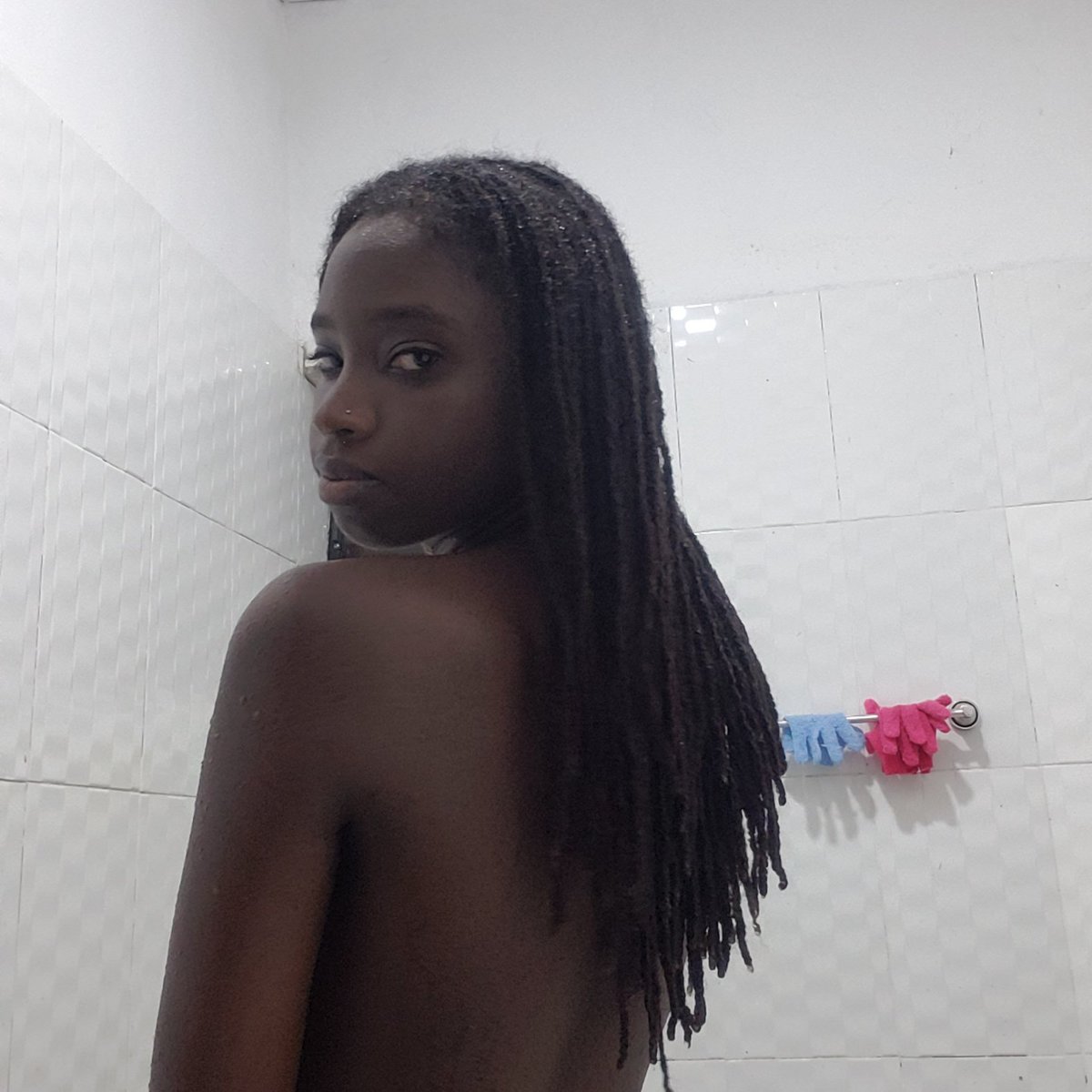 Picture of me in a white bathroom with my hair down my back