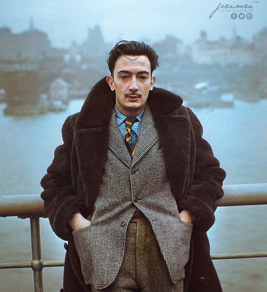 Salvador Dali standing on the deck of the S.S. Normandie as it docks in New York City, 1936