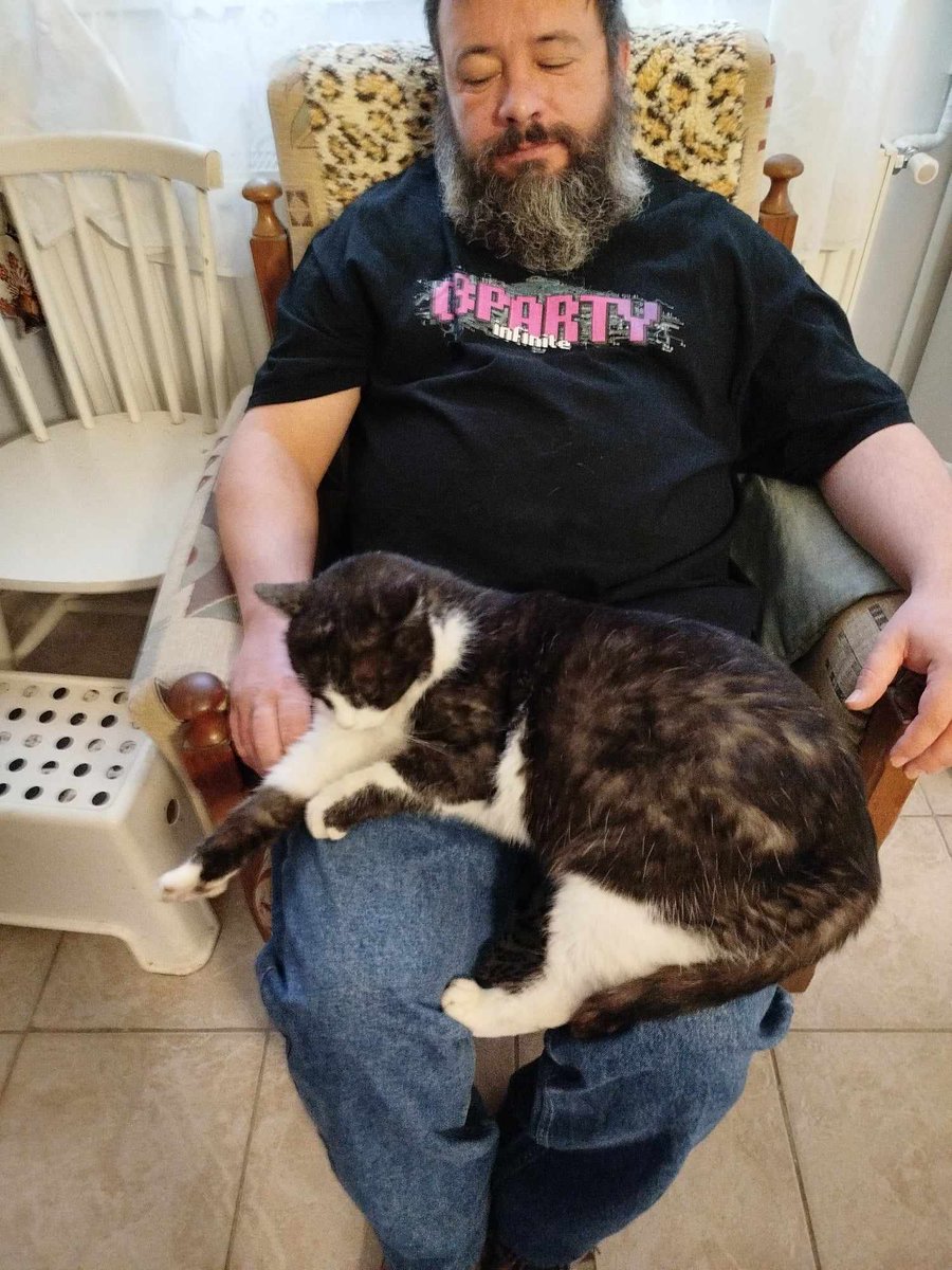 Old grumpy man with an old but cute cat. 
Karesz <3