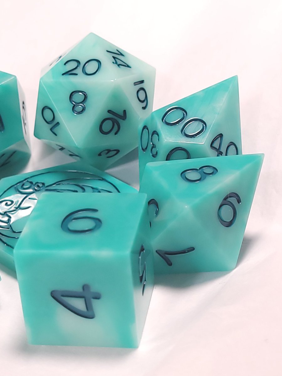 FlutesCreations's tweet photo. Well, it's Monday sigh...... Today is not great, but life goes on. Here is another pretty set of dice. 

Whispy Teal

(Currently working to get the new sets on the website.) https://t.co/rVErBUiXU1