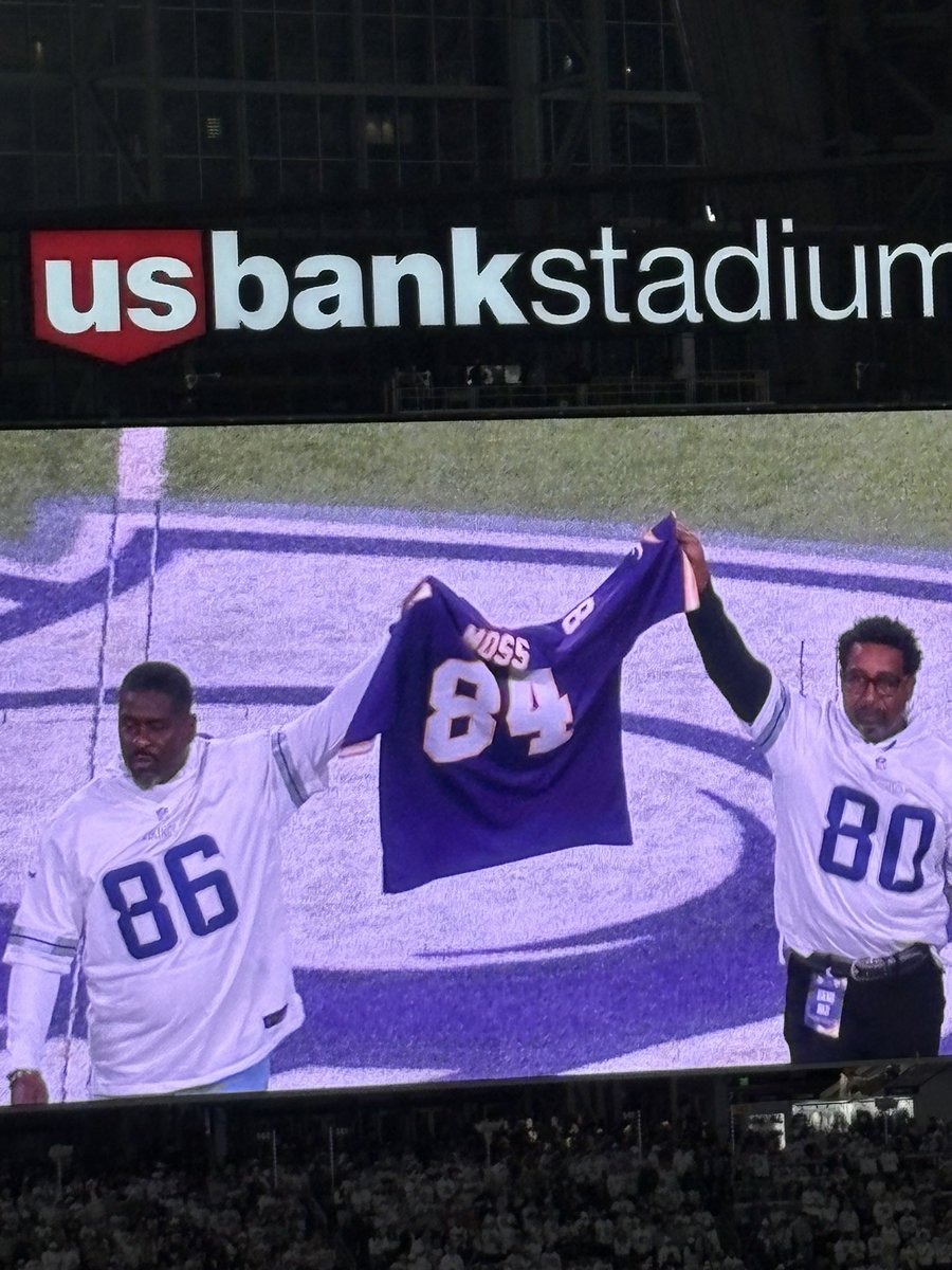 Jake Reed and Cris Carter holding up a Randy Moss jersey #ThreeDeep #LetsMossCancer