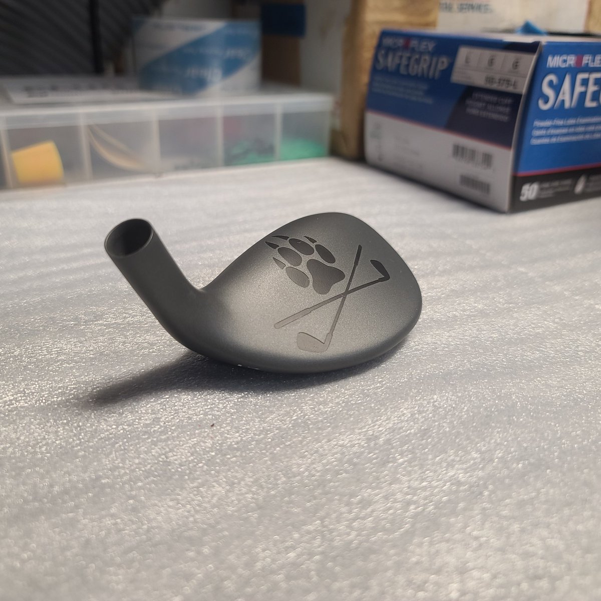 arcade_the_wolf's tweet photo. It's not often that I'm allowed to share pics of my work, but today was a slow day, so I had time to respray one of my golf clubs. Elite Carbon Grey Cerakote with Crimson and Storm Trooper White color fill. Graphite Black wolf paw and crossed clubs. https://t.co/HjVZfL5eUn