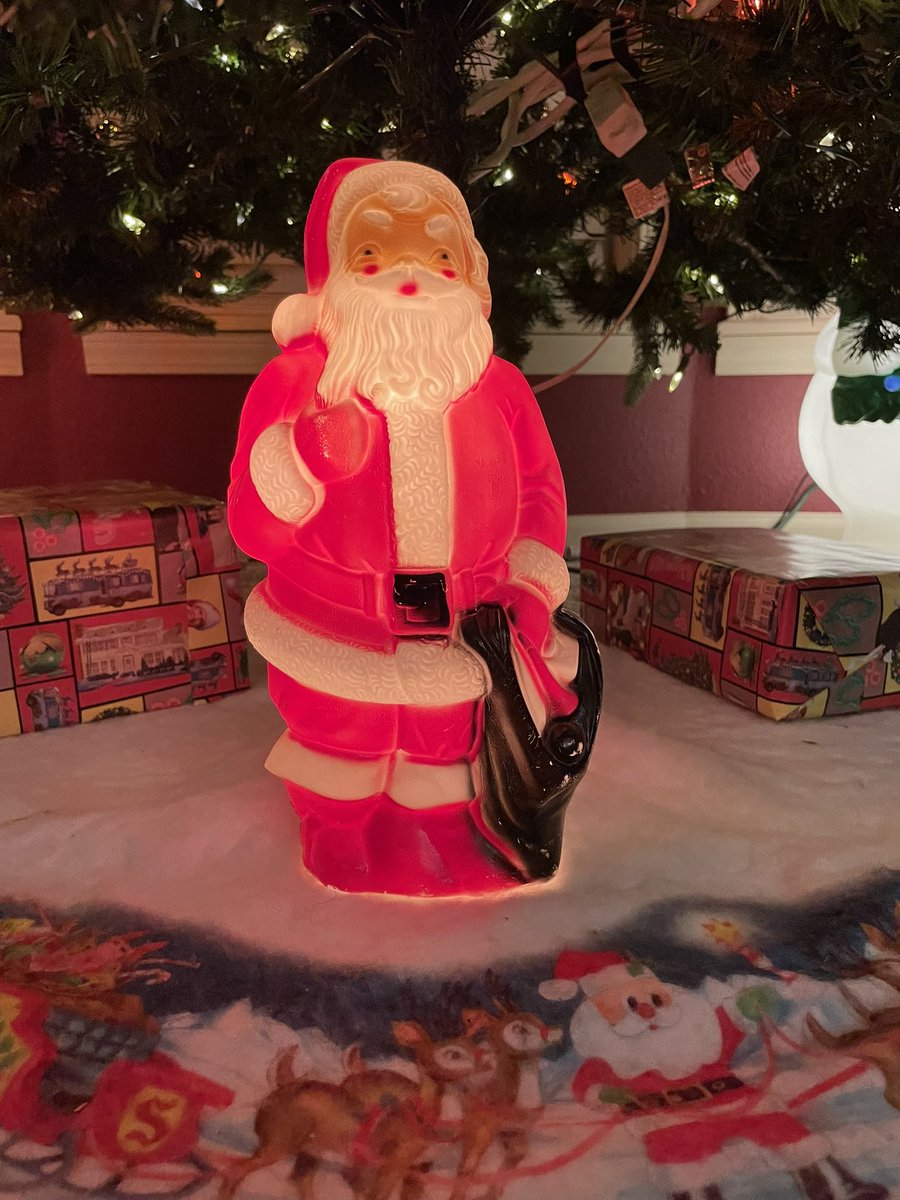 I have had the same blown mold Santa at the base of our Christmas tree since was little kid. I still carry on the tradition.