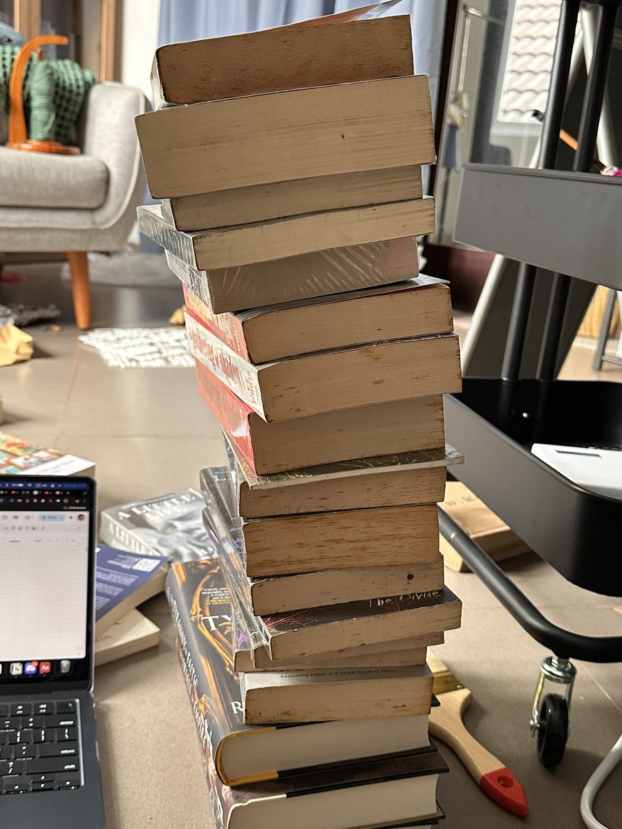 luneillei's tweet photo. welcome to the leaning towers of my library https://t.co/ArXzbMtiHR