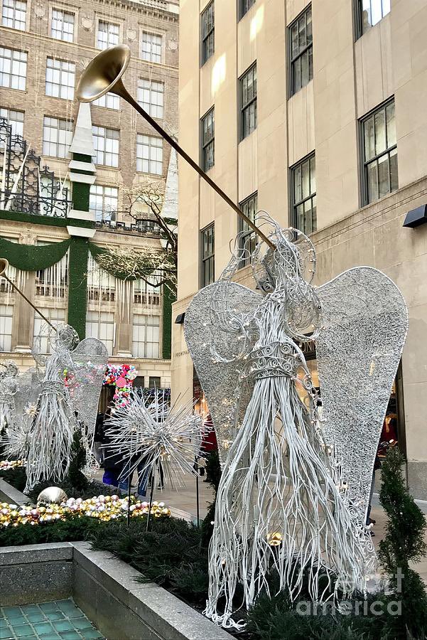 CACGraphics's tweet photo. Holiday time in New York City!🎊
“Angel New York City”🌟
Prints &amp; accessories available-
> https://t.co/EbY8jafjDI
#angel #NewYorkCity #ChristmasTree #Christmas #RockCenterXMAS #artprints #artforsale #puzzles #wallart #homedecor #photography #gifts #giftideas #interiordesign https://t.co/BZOC0b2vCR