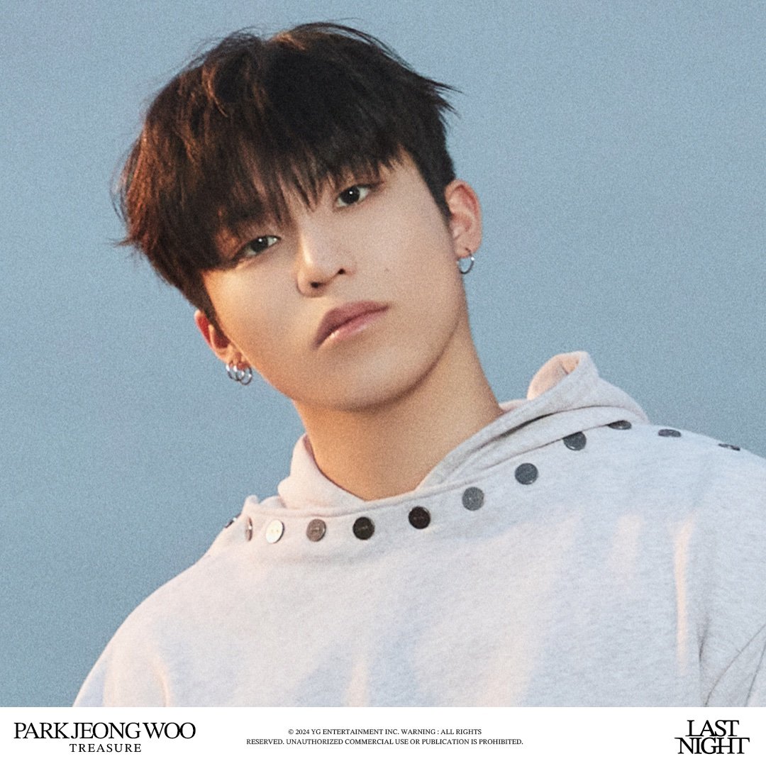 Embracing the radiance of individuality and the profound allure of simplicity. The soft, muted tones of the ensemble harmonize seamlessly with the tranquil backdrop, illuminating the essence of quiet confidence.