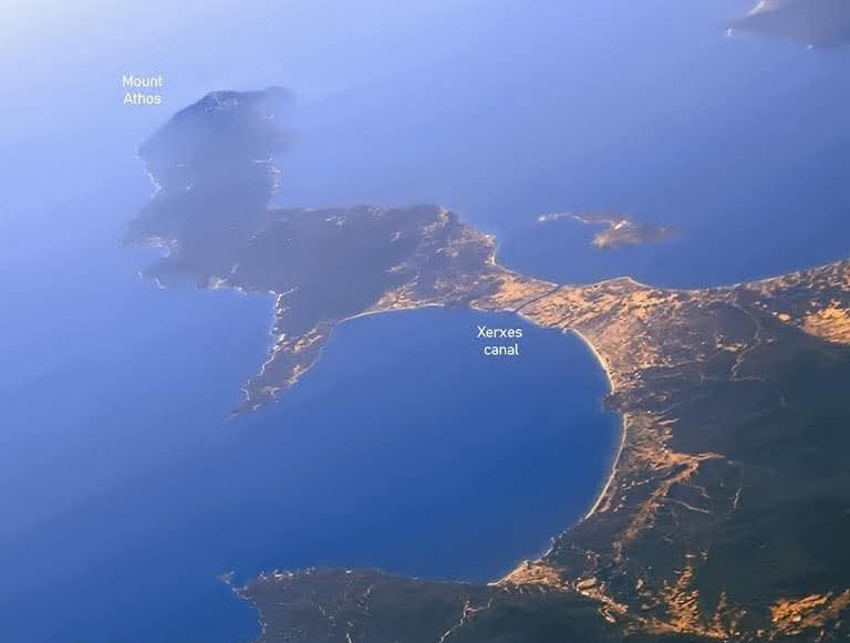 archeohistories's tweet photo. Xerxes Canal was a navigable canal through the base of Mount Athos peninsula in Chalkidiki, northern Greece. It was commanded to be built by king Xerxes I of Persia in 5th Century BC, and was overseen by his engineer Artachaees. It was part of Xerxes' preparations for his second invasion of Greece, a part of the Greco-Persian Wars. It is one of the few monuments left by the Persian Empire in Europe.

According to the Histories of the ancient Greek historian Herodotus, which recounts the events of Greco-Persian Wars, the Persian commander Mardonios, in 492 BC, lost a great part of his fleet, 300 ships and 20,000 men, in a storm going around the cliffs of the Athos peninsula, during the First Persian invasion of Greece. Herodotus offers a description of a canal that was dug by the Persian king Xerxes. There is archaeological evidence. The story is translated by translated by Aubrey de Sélincourt...

[7.22] On the previous occasion, it will be remembered, the Persian fleet came to grief in the attempt to round Mount Athos. In view of this, work had been going on here for the past three years or so [483-480] to prevent a repetition of the disaster. A fleet of triremes lay at Elaeus in the Chersonese, and from this base men of the various nations of which the army was composed were sent over in shifts to Athos, where they were put to the work of cutting a canal under the lash. The natives of Athos were also forced to help dig. Bubares the son of Megabazus and Artachaees the son of Artaeus were the Persian officers in charge.

Everyone knows Mount Athos - that lofty promontory running far out into the sea. People live on it, and where the high land ends on the landward side it forms a sort of isthmus with a neck of about a mile and a half wide, all of which is level, except for a few low hills, right across from the coast by Acanthus to the other side near Torone. On this isthmus to the north of the high ground stands the Greek town of Sane, and south of it, on Athos itself, are Dium, Olophyxus, Acrothoon, Thyssus and Cleonae - the inhabitants of which Xerxes now proposed to make islanders.

[7.23] I will now describe how the canal was cut. A line was drawn across the isthmus from Sane and the ground divided into sections for the men of the various nationalities to work on. When the trench reached a certain depth, the laborers at the bottom carried on with the digging and passed the soil up to others above them, who stood on ladders and passed in on to another lot, still higher up, until it reached the men at the top, who carried it away and dumped it. Most of the men engaged in the work made the cutting the same width at the top as it was intended to be at the bottom, with the inevitable result that the sides kept falling in, and so doubled their labor. Indeed they all made this mistake except the Phoenicians, who in this - as in all practical matters - gave a signal example of their skill. They, in the section allotted to them, took out a trench double the width prescribed for the actual finished canal, and by digging at a slope gradually contracted it as they got further down, until at the bottom their section was the same width as the rest. In a meadow near by the workmen had their meeting place and market, and grain ready ground was brought over in great quantity from Asia.

[7.24] Thinking it over I cannot but conclude that it was mere ostentation that made Xerxes have the canal dug - he wanted to show his power and to leave something to be remembered by. There would have been no difficulty at all in getting the ships hauled across the isthmus on land; yet he ordered the construction of a channel for the sea broad enough for two ships to be rowed abreast. [....]

#archaeohistories