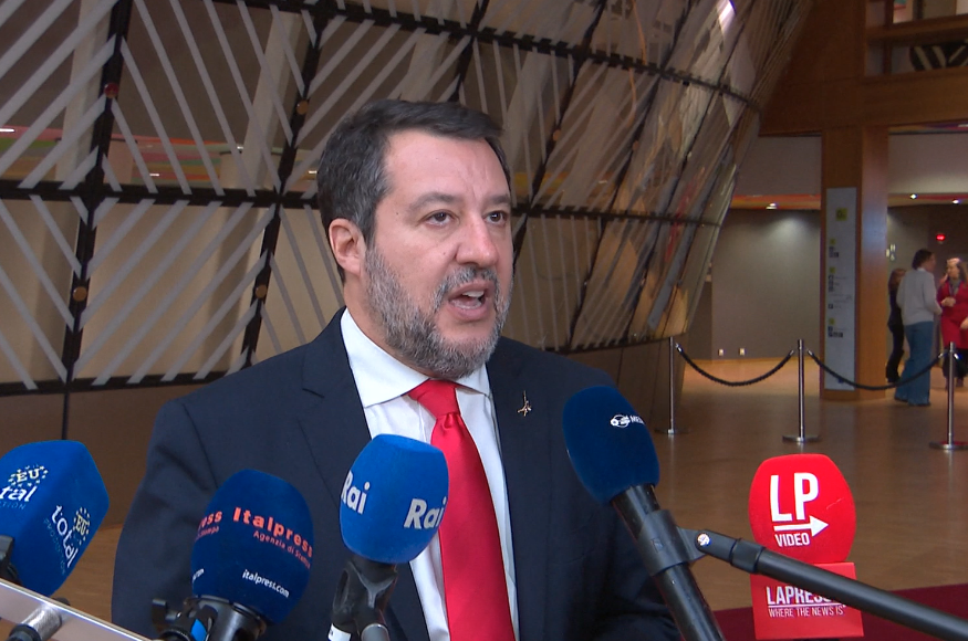jameskanter's tweet photo. Matteo Salvini wearing a shiny red Trump tie at European Council HQ in Brussels today. Sartorial options include tucking the tie into his Putin t-shirt for an authentically transcontinental Christian Nationalist vibe. #EUCO #cravattarossa https://t.co/mxLYK0MeTR