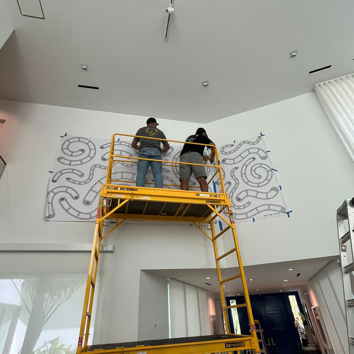atelier4llc's tweet photo. Installing art is a process that demands precision and careful execution. See our trained technicians at Atelier 4 take the time to measure, plan, and install this vibrant Josh Sperling wall artwork of shaped canvases for a client’s residence in Miami. https://t.co/IqGkUpei8S