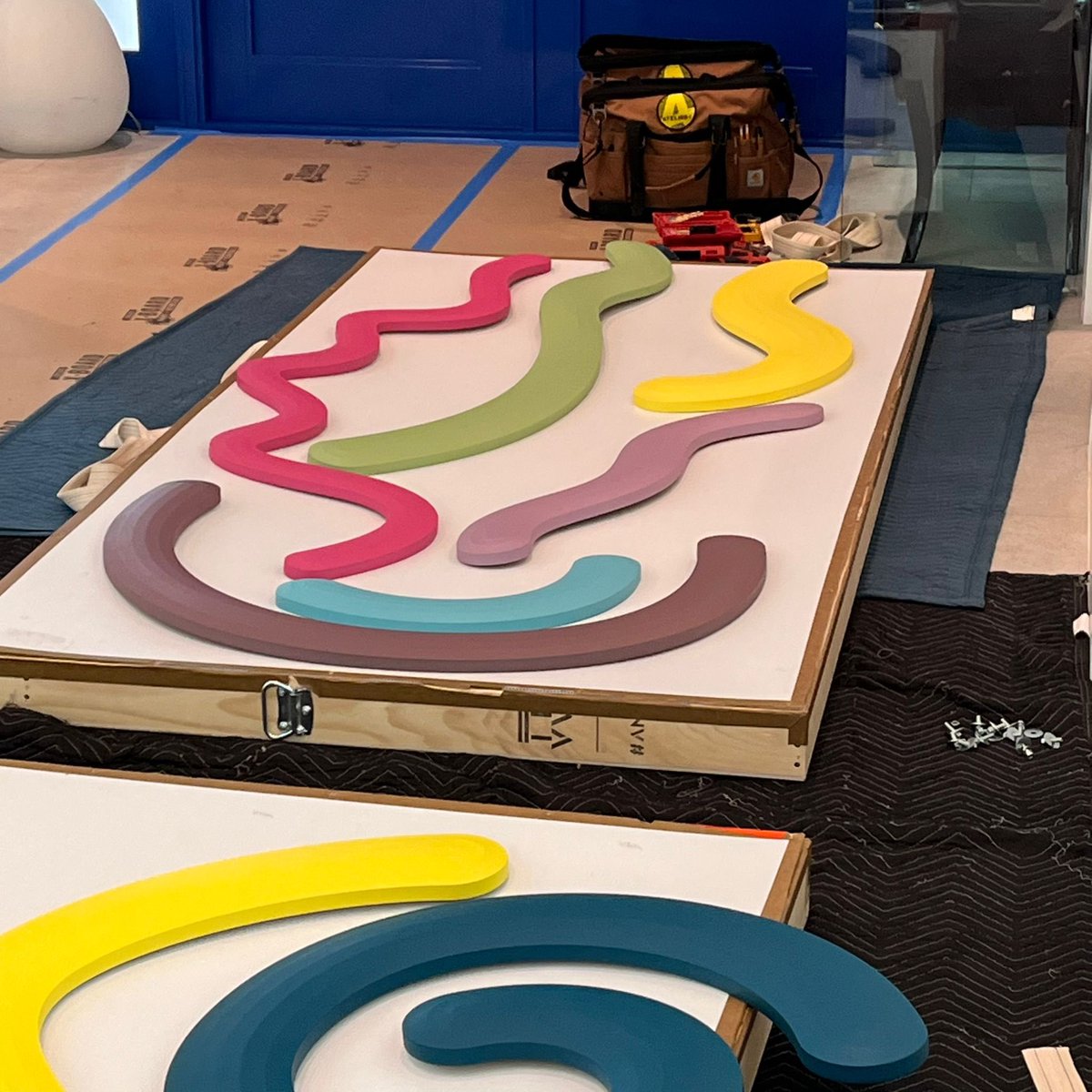 atelier4llc's tweet photo. Installing art is a process that demands precision and careful execution. See our trained technicians at Atelier 4 take the time to measure, plan, and install this vibrant Josh Sperling wall artwork of shaped canvases for a client’s residence in Miami. https://t.co/IqGkUpei8S