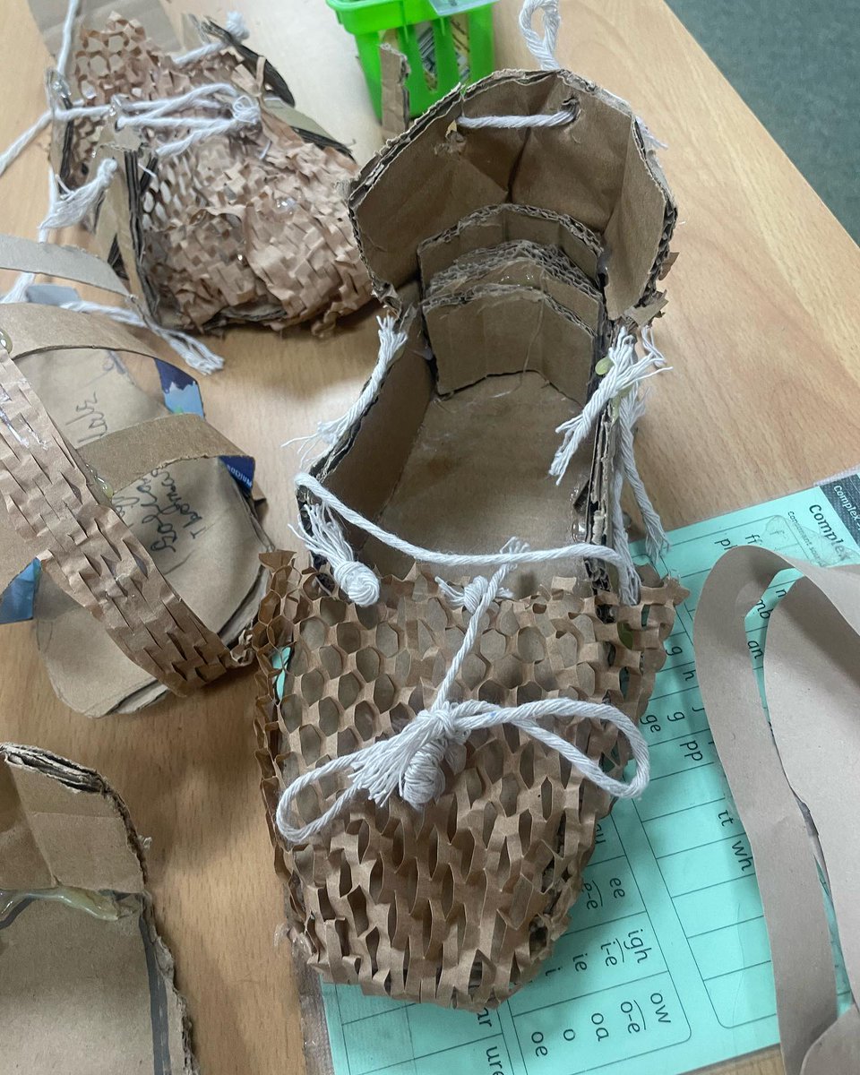 nlancingprimary's tweet image. "We're learning about Romans &amp;amp; we made a sandal! We cut cardboard to make the base &amp;amp; glued cardboard to make straps. We hole punched them &amp;amp; threaded string through &amp;amp; tied them. We tried them out,walking down the corridor to see if the shoe would stay in one piece - some did not!"