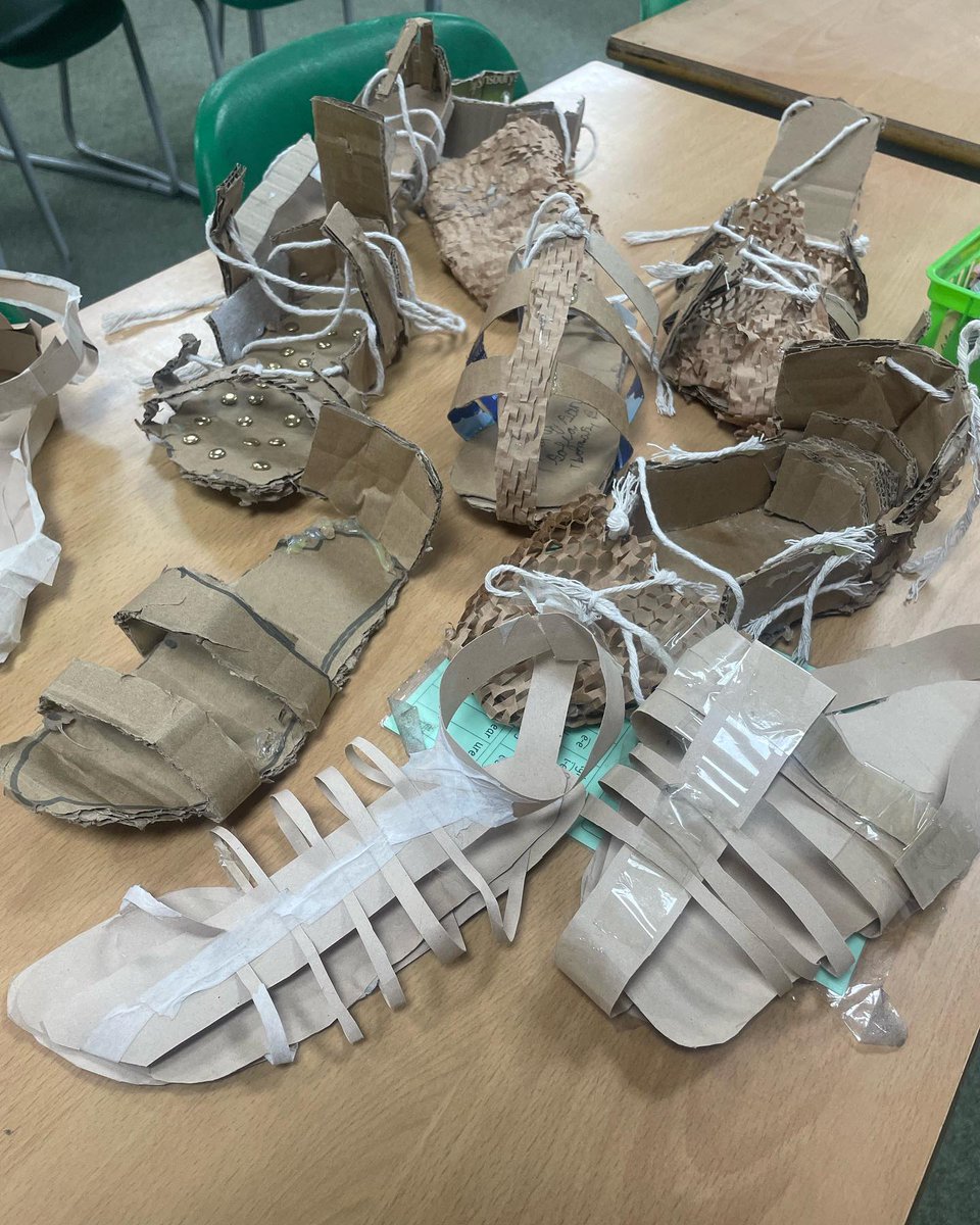 nlancingprimary's tweet image. "We're learning about Romans &amp;amp; we made a sandal! We cut cardboard to make the base &amp;amp; glued cardboard to make straps. We hole punched them &amp;amp; threaded string through &amp;amp; tied them. We tried them out,walking down the corridor to see if the shoe would stay in one piece - some did not!"
