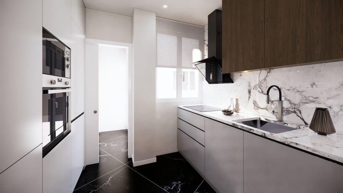 Diseño de cocina con un pavimento con textura de mármol en acabado negro liso y vetas blancas, combinado con un revestimiento porcelánico en un calacata gold, piezas de gran formato. #arquitectura #diseño #decoracion #reformas #reformasdecasas #cordoba