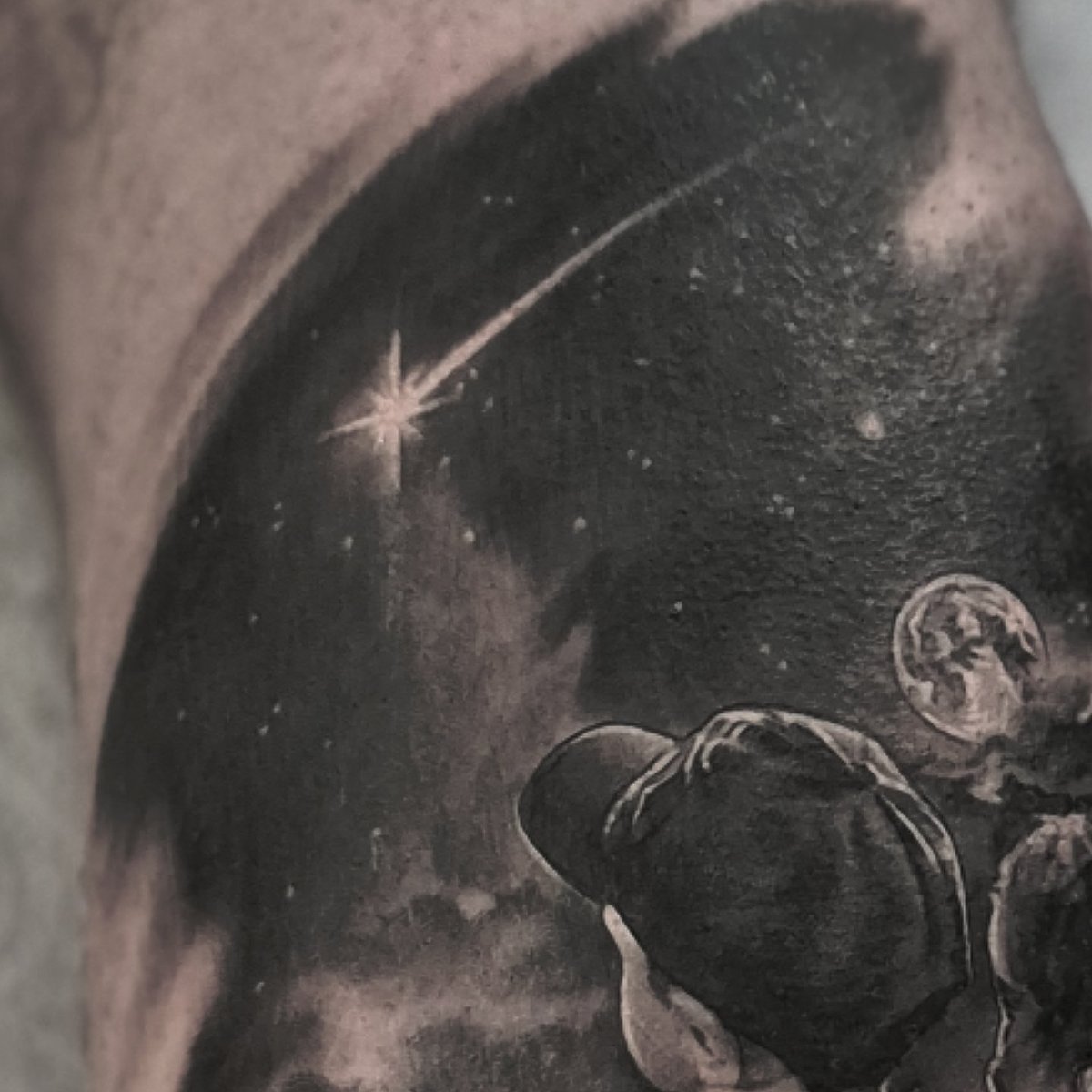 JayTAT2's tweet photo. A few months back, Cian sent me a photo that he loves of his kids. He asked me if i could come up with a design, using that image, but where they were sat in front of a night sky with a shooting star instead of the original background of the photo. 
Today, Cian flew over from Ireland for his appointment. 
He and I are both made up with how this turned out.

Thanks to all my clients who come from far and wide to get tattooed by me. I love this job and appreciate you all ❤️

Swipe to see the original photo

Tattoo Appointments email - jay.hutton@outlook.com