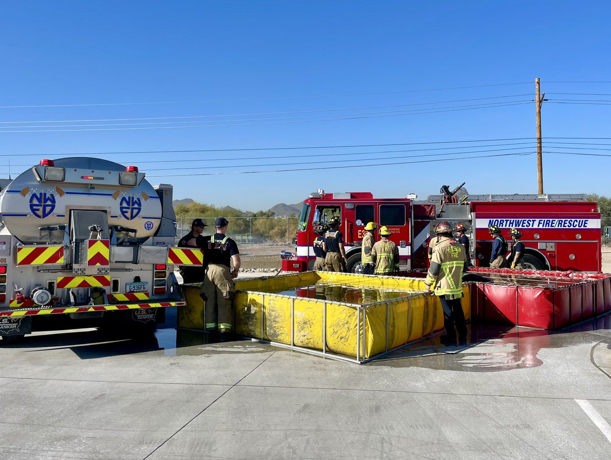 NorthwestFire's tweet photo. Northwest Fire District crew members from Station 333 and Tucson Fire Department crew members from Station 8 joined forces today to #drill on water tender operations. It’s a great day for training and teamwork with our #autoaid partners @TucsonFireDept! https://t.co/KWiPPUnFCc