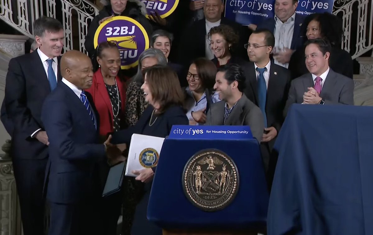 emmagf's tweet photo. Gov. Kathy Hochul and Mayor Eric Adams celebrate the City of Yes vote at City Hall. 
She has kept her distance from him in public since his indictment, but she says she was happy to provide $1 billion in state funding to secure a deal. Notably missing: speaker Adrienne Adams. https://t.co/EzdC9dc7UC