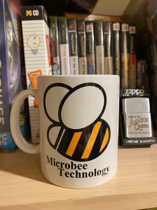 JohnPassfield's tweet photo. This is one of my fave coffee cups - with the Microbee logo. The Microbee was the Aussie designed/built computer that I made the original Halloween Harry on back in 1985! #IndieDev #IndieGames #RetroGames #Microbee https://t.co/SX2poAo9S5
