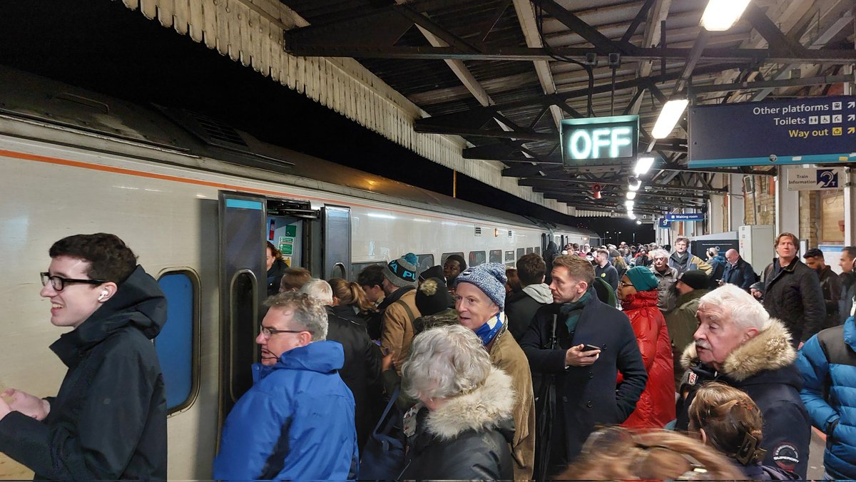 grahamarmfield's tweet photo. @SW_Help More madness at Clapham Junction after 10pm tonight. This is a 3 coach Yeovil train which was already packed when it arrived. For some of these people this is their last train home, but few people can get on. Only 3 coaches??!! https://t.co/O7intgXWqC