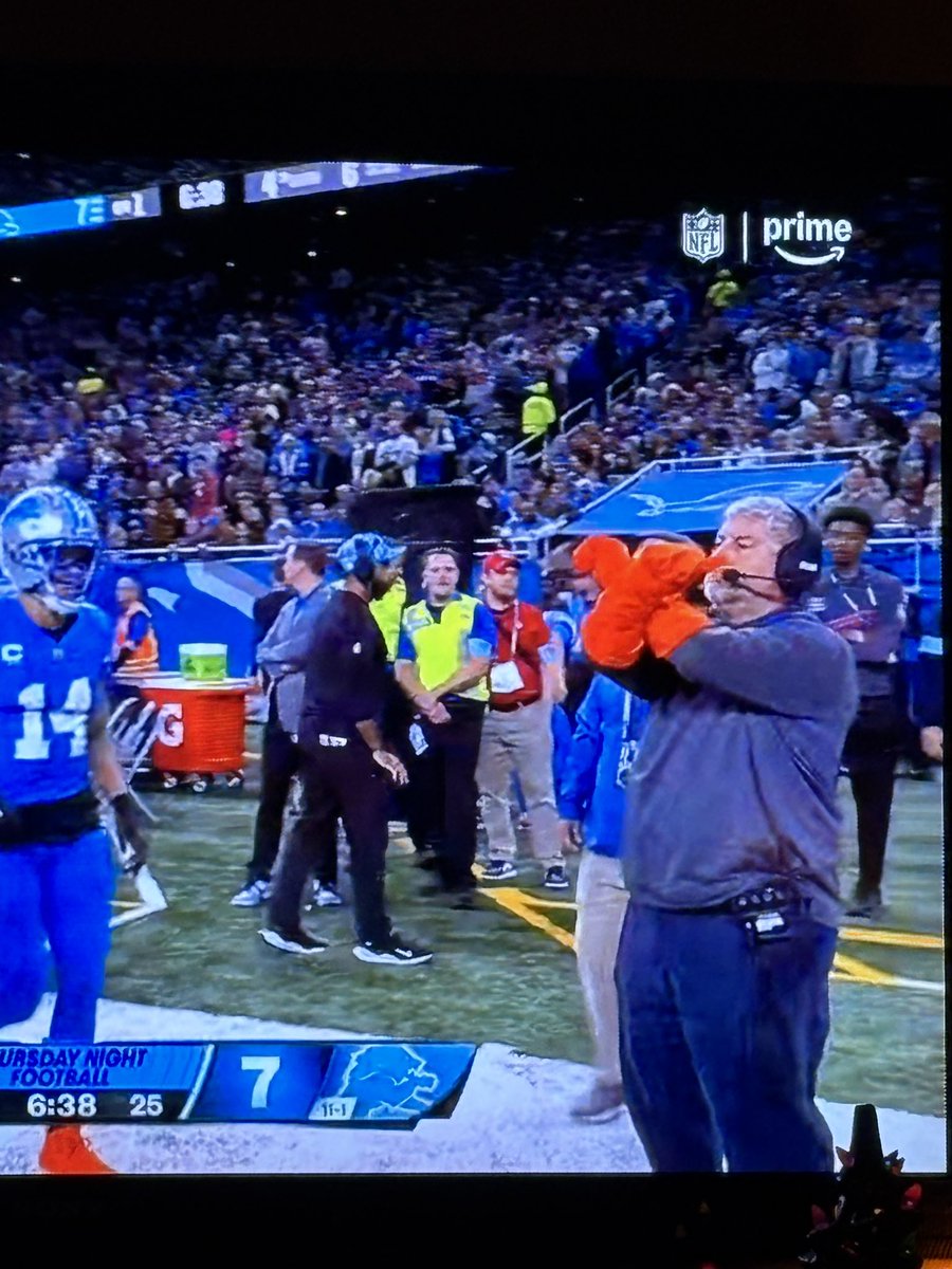 Of all the technological changes/advances we’ve seen in broadcasting football games, there’s one thing that stands the test of time…and that’s the guy with the orange gloves signaling broadcast commercial breaks/timeouts to the refs.