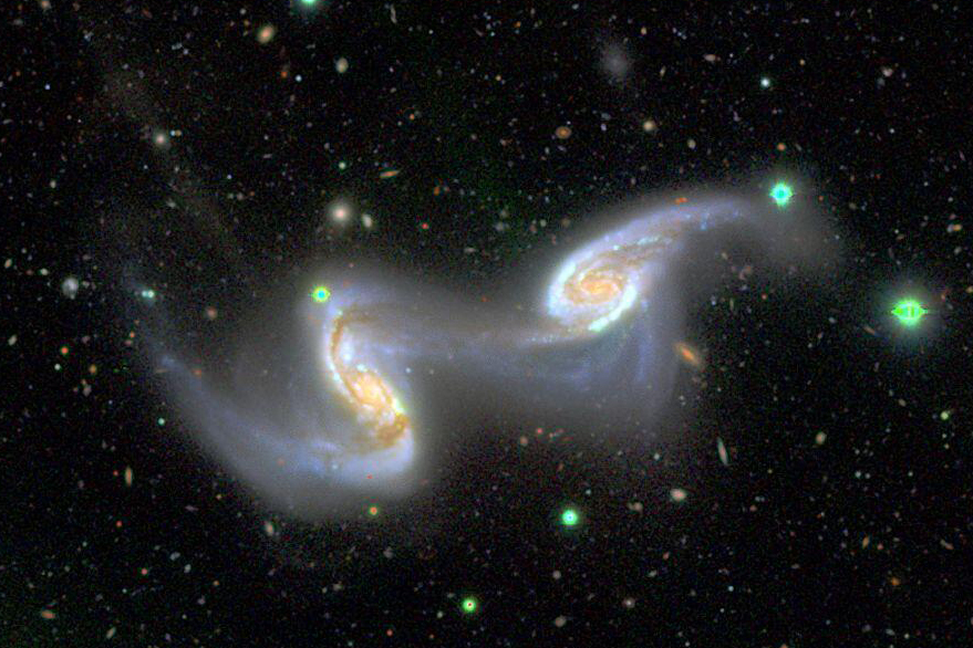 SubaruTel_Eng's tweet photo. As a #SubaruTelescope 25th anniversary project, we post two new images monthly on the Gallery page. 
NGC 5257 and NGC 5258, a pair of interacting spiral galaxies, have a bridge-like interacting feature of faint stars, resembling two dancers holding hands.
https://t.co/yKn9h7eTBv https://t.co/LqUduRvhDx
