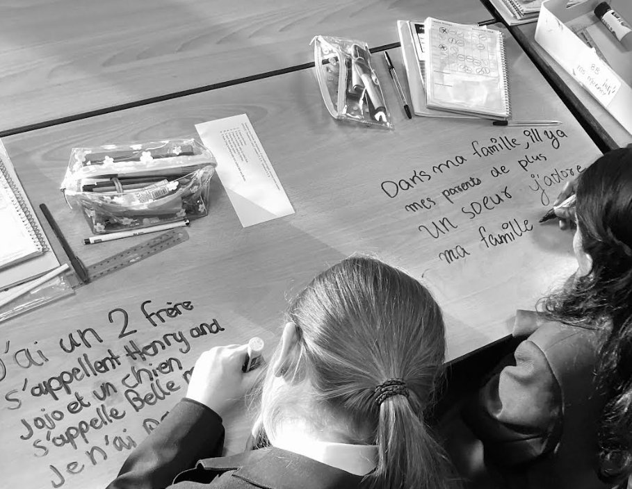 Huxlow's tweet image. Yesterday, our Year 7 students showcased their linguistic talents in French class, and we couldn&apos;t be prouder! Miss Maubert was truly impressed with the high quality of sentences the students wrote about their families, right on their tables. #Ambition #Pride #FrenchClass