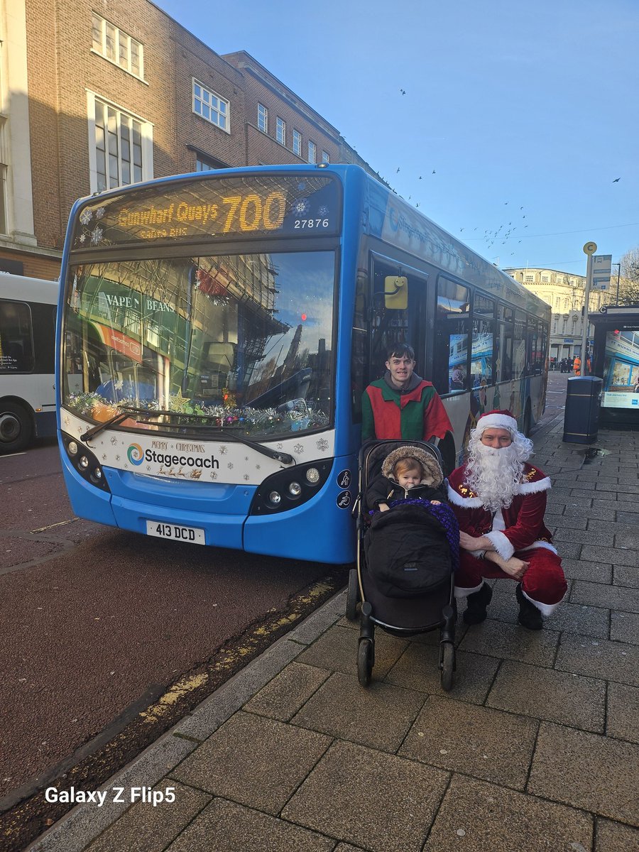 Shaunland13's tweet photo. #SantaBusSouth @StagecoachSouth my daughter with santa aka colin ayres on route 700 https://t.co/hYAwLNRYKX