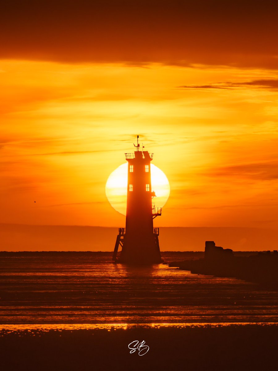This morning’s sunrise lined up with North Bull Lighthouse from Dollymount Beach.