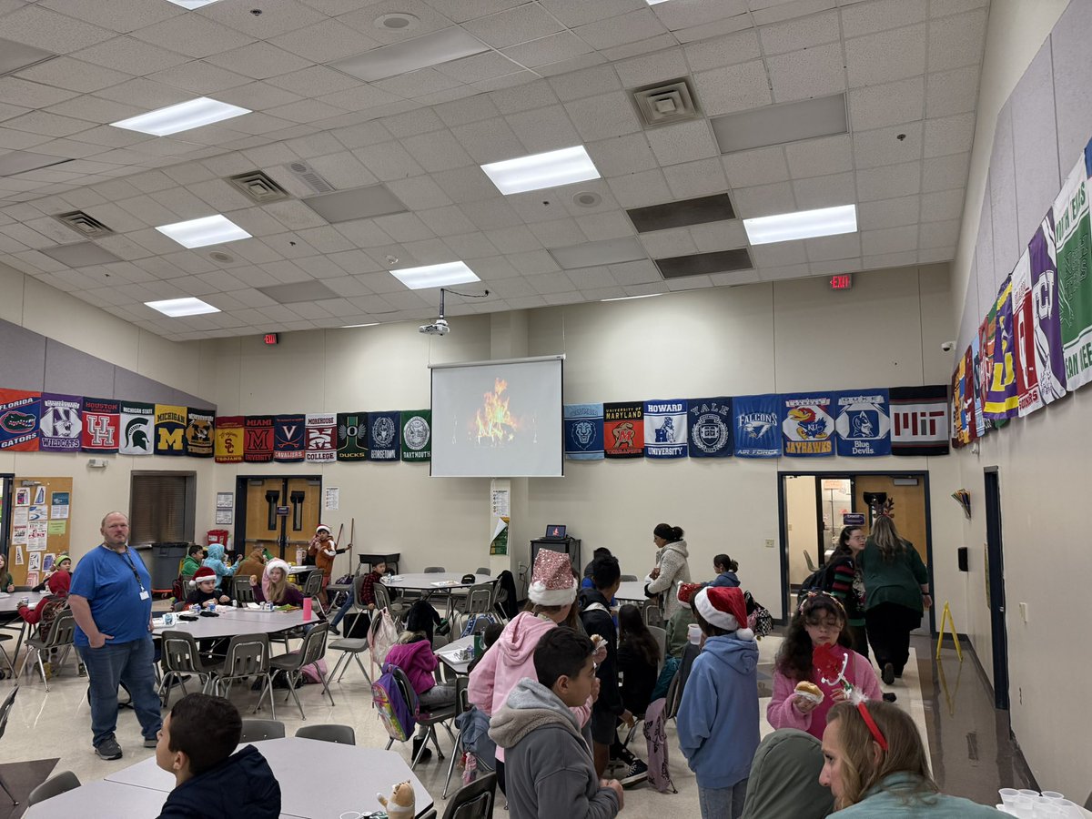Middle school students spending a free morning at Hightower Elementary and visiting classrooms to read