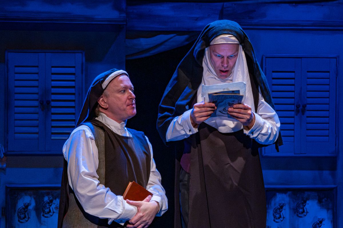 Two nuns (Stephen Cavanagh and Darren Seed) look at a drawing. One looks disgusted and the other self-righteous.