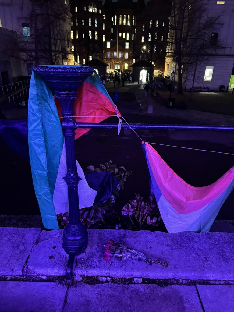 XineYaoPhD's tweet photo. Had a meeting clash so I think I missed the vigil for Refaat Alareer

But I’ve left flowers by the flags on the UCL Portico https://t.co/jNMbZWTqXl
