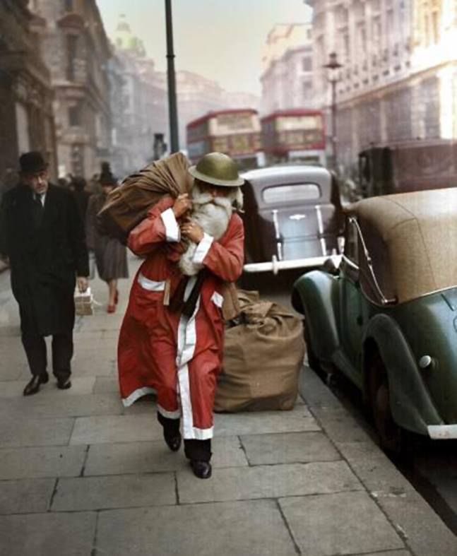 Good Afternoon 
Here is a Santa who isn’t going to let the wartime worry stop him from delivering his presents 
Great photograph