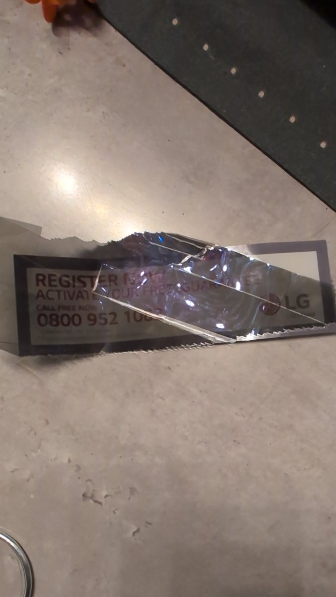 Lfcmonkey's tweet photo. @LGUKCare Had a new G4 delivered today from Very and the warranty sticker was underneath the reflective layer. I assumed I had to remove a protective film but there wasn't one and the warranty sticker is underneath the actual dark layer. TV ruined. Very don't have any stock now https://t.co/RotYEjsmsc
