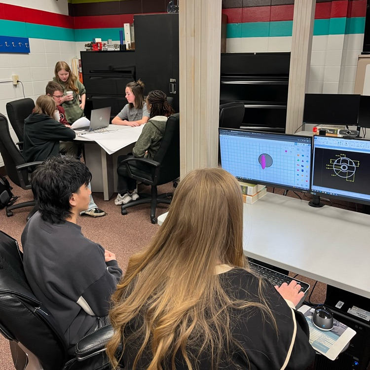 Simulated pre-construction meeting with second year students getting ready for collaboration with third year technical design students. Giovanni and Mrs. Wallace working with first years finalizing ornament designs before they head to the additive printing lab. #CTESOLUTIONS