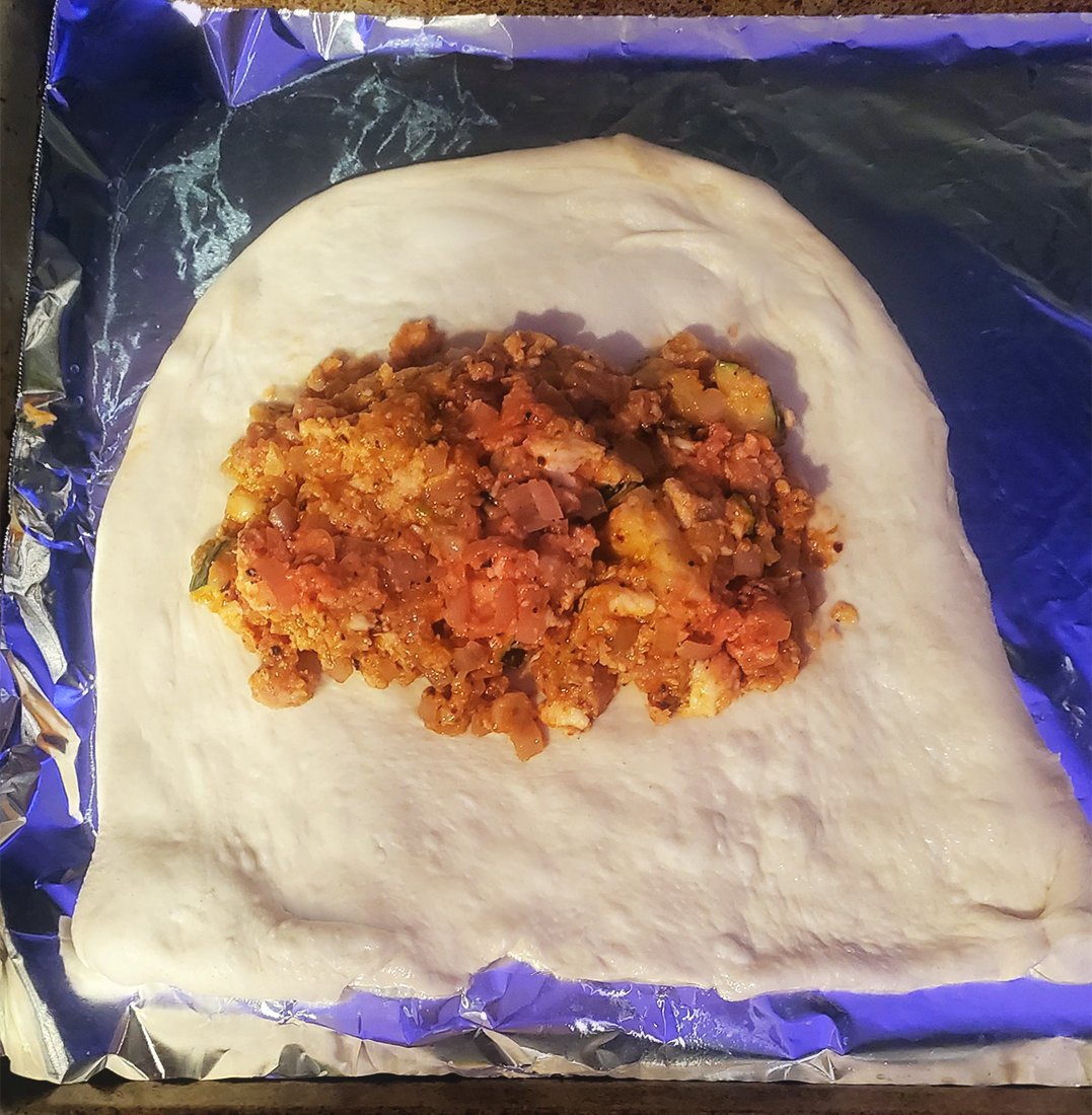 RingmasterDBX's tweet photo. Was taking a break making calzones for lunch. Went to fold up the last one and I kid you not...the abyss stared back! #DeathBattle #AmongUs https://t.co/tx7rmAcSvS