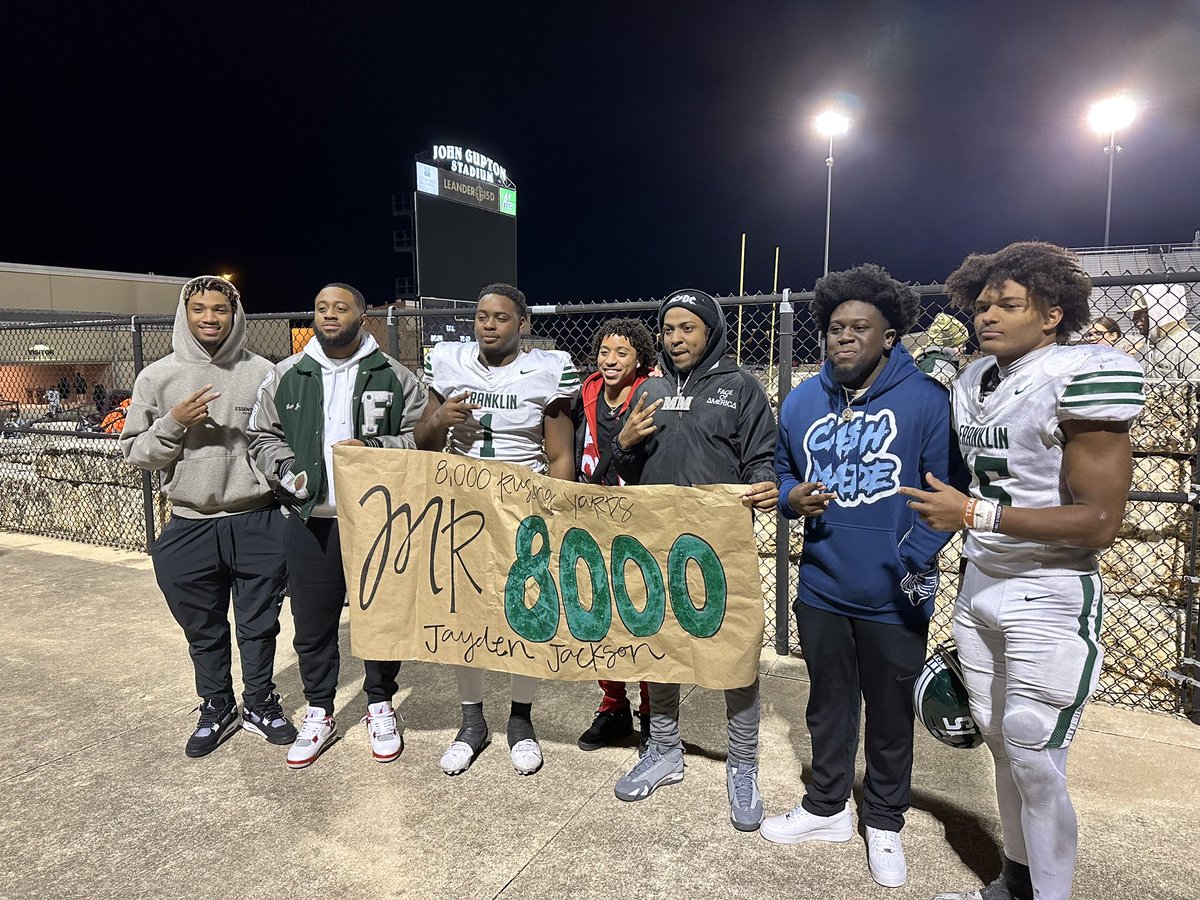 Jayden Jackson with some Franklin legends pose with the Mr. 8,000 sign after the game.

Ends his #txhsfb career with 8,035 yards. Got to cover Jayden all the way thru. Great kid. Relentless runner. And just a straight up winner.