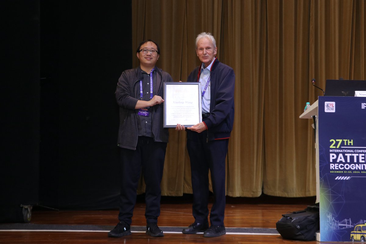 xiaolonw's tweet photo. I was in #ICPR at Kolkata, India to accept the J. K. Aggarwal Prize. I gave a talk on connecting the old work we did for SSL, Video Understanding to the current work we are doing for Robotics. https://t.co/rpzhYq561k