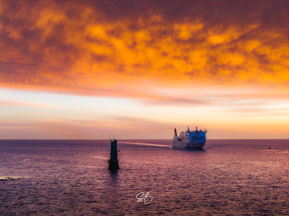 Stena Line coming onshore into Dublin Bay on Friday morning beside North Bull Lighthouse with a fiery sky overhead. Taken with the 70mm lens on the Air 3S.