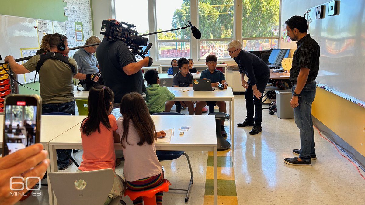 60Minutes's tweet photo. Anderson Cooper visited schools in Indiana and California to see how classrooms are embracing Khanmigo, a new AI tutor. Its potential is staggering, but it's still very much a work in progress. 60 Minutes, Sunday. https://t.co/mEN4CWeXMW https://t.co/M0Sk4Op6Ma