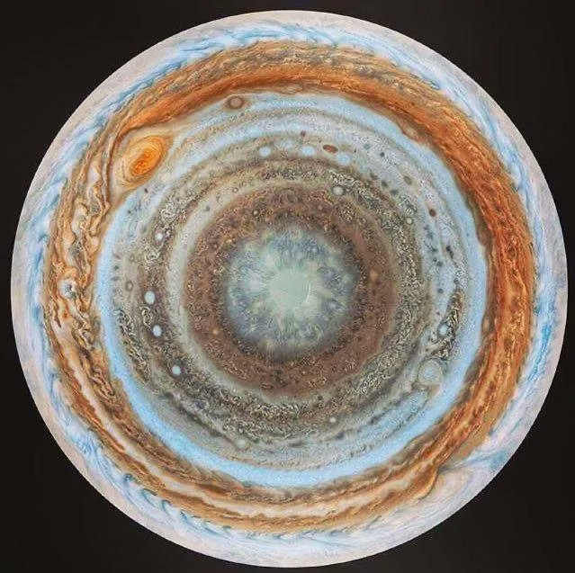 CuriosityonX's tweet photo. Jupiter as viewed from its South Pole... https://t.co/V6AIBQpqQP