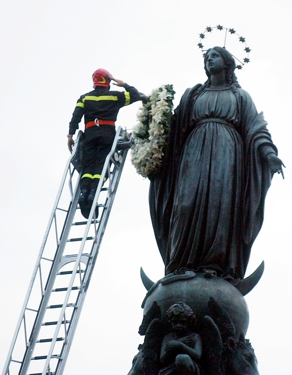 On December 8, Rome's firefighters honor the Virgin Mary by placing a flower wreath on her statue in Piazza di Spagna, a tradition dating back to 1857 that marks the Feast of the Immaculate Conception.