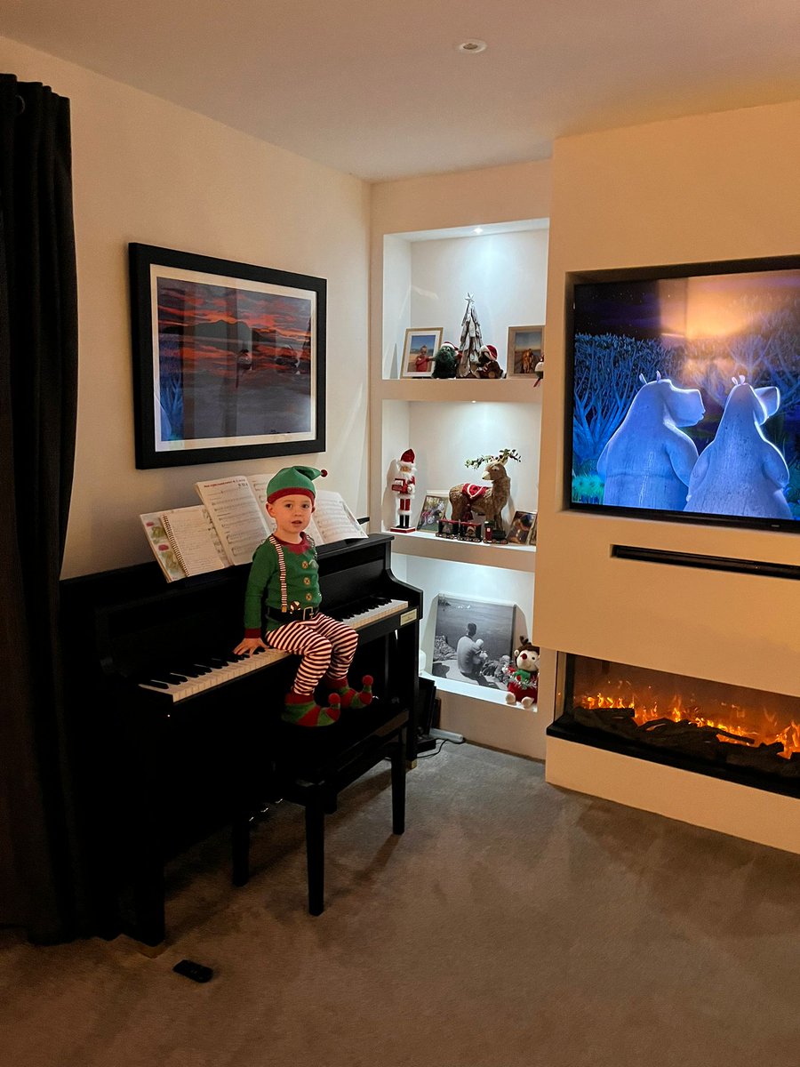 A Grandson Elf on the piano named Jude