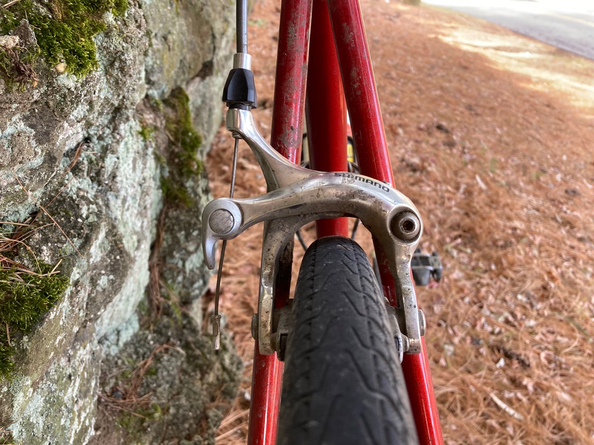 bikesnobnyc's tweet photo. Medium-reach brake.  32s and you could still fly a plane through there.  If the industry hadn't gone with short reach all this disc-brakes-on-road-bikes crap could
have been avoided. https://t.co/fgXDlq69MZ