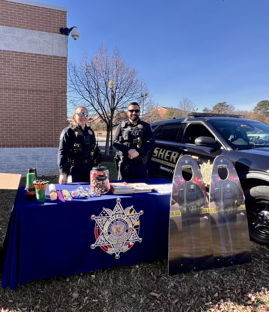 firstsheriff's tweet photo. Happy Holly Days! Deputy Wynnyk and DFC Roszell are collecting new and gently used children’s coats at the Holly Days Extravaganza at the Lexington Park Library. Come by to say hello and donate coats to needy children in our community.
#FirstSheriff https://t.co/L58aSNjmwM