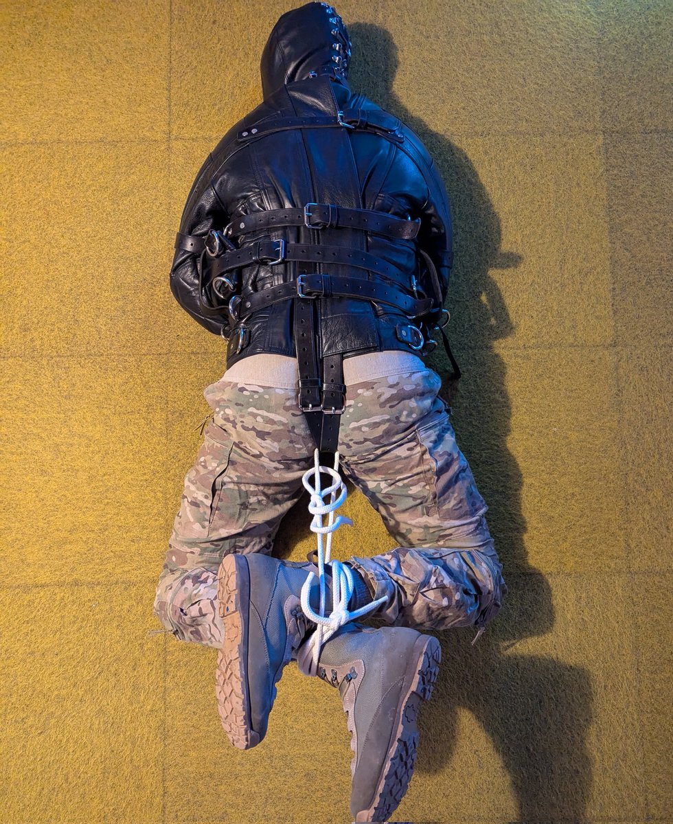 Army boy in leather straitjacket. He is getting restless now... But long way to go!