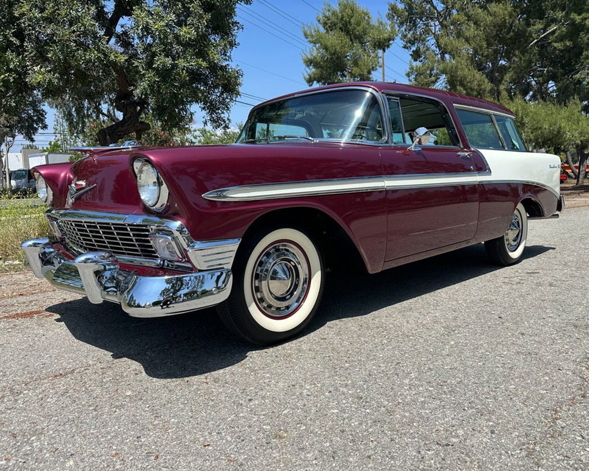 Barrett_Jackson's tweet photo. The recipient of a meticulous five-year #restoration, this 1956 @Chevrolet #NomadWagon is finished in Dusk Plum over India Ivory and powered by a period-correct authentic 265/195hp #V8 engine with a 4-barrel carburetor mated to a 2-speed Powerglide automatic transmission. https://t.co/JYfzBQ3RlD